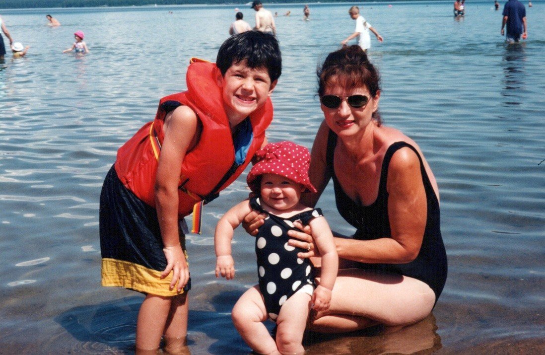 Drew as a boy at the lake with his mom and baby sister